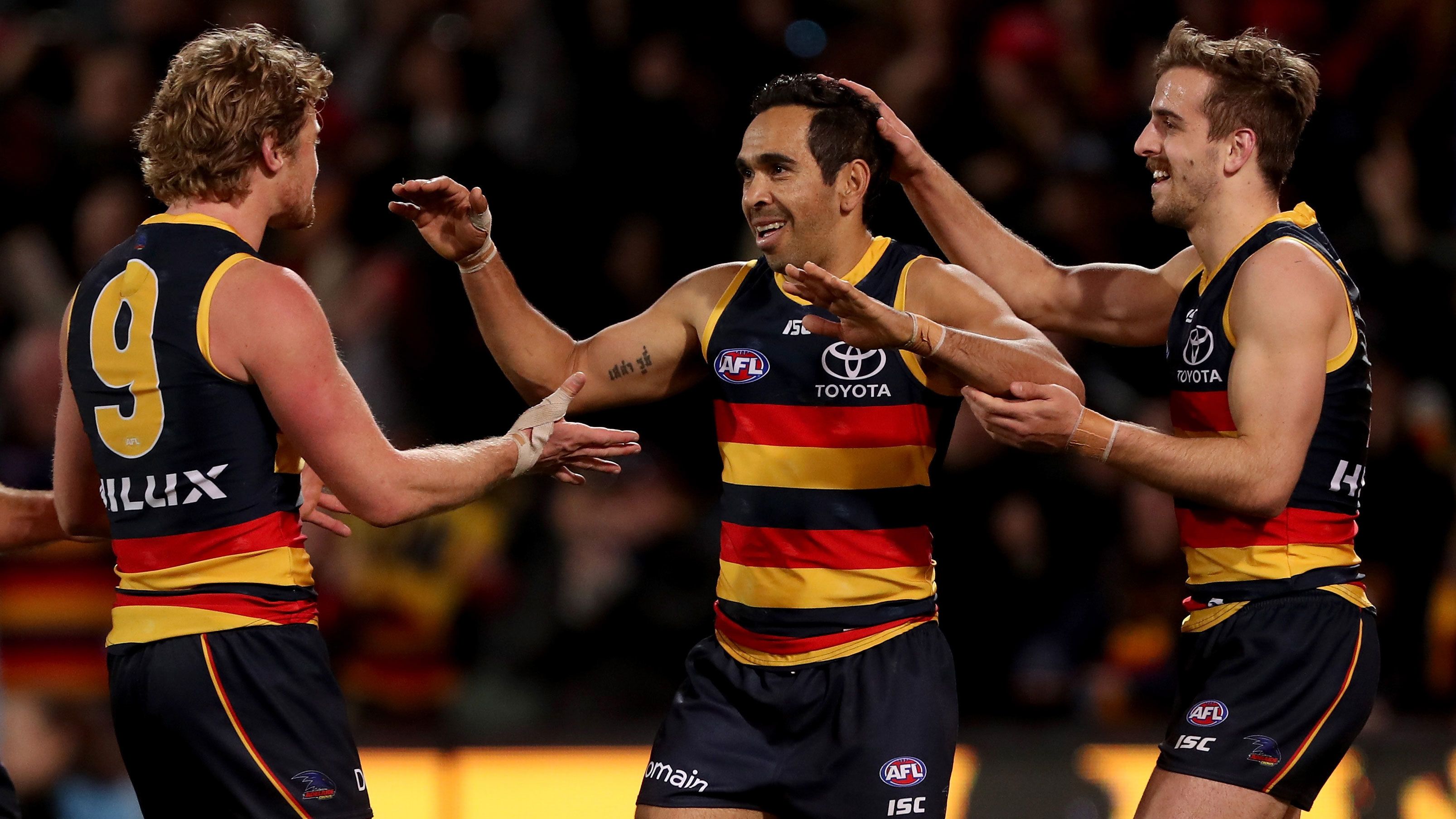 Eddie Betts celebrates a goal with Crows teammates in 2018.