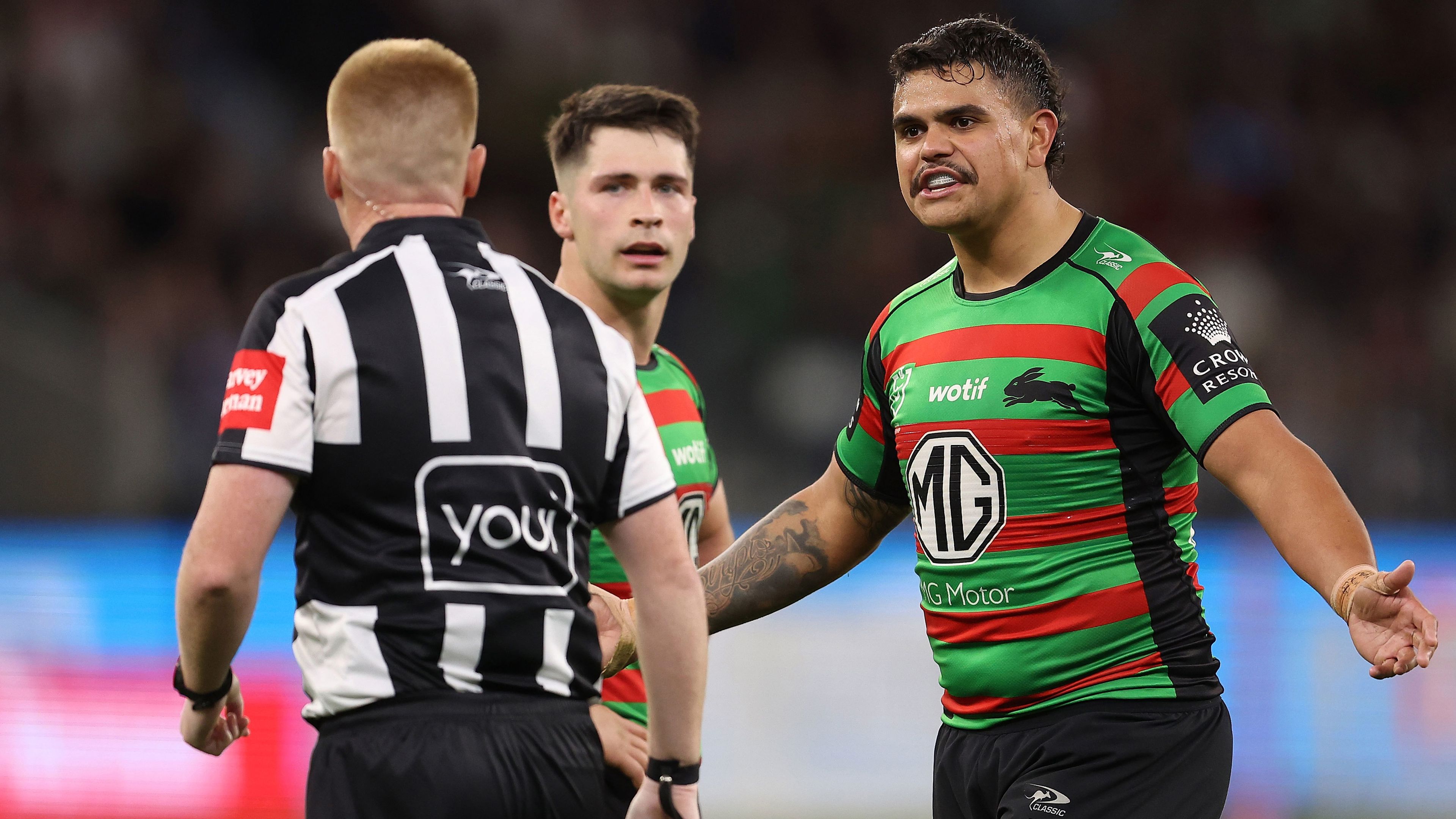 Latrell Mitchell of the Rabbitohs talks with referee Todd Smith during the Rabbitohs&#x27; round 23 match against the Sharks.