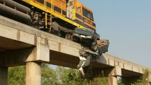 Australia's luckiest motorist? Northern Territory train ploughs into car stuck on track 