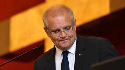 Prime Minister Scott Morrison performs a reading during Good Friday Easter services at St Charbel's Catholic Maronite Church at Punchbowl.