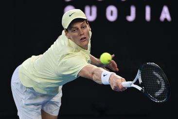 Jannik Sinner of Italy plays a backhand against Alexander Zverev of Germany in the Men&#x27;s Singles Final during day 15 of the 2025 Australian Open at Melbourne Park on January 26, 2025 in Melbourne, Australia. (Photo by Quinn Rooney/Getty Images)