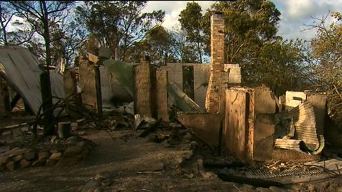 They picked their way through their property, salvaging what they could.  (9NEWS)