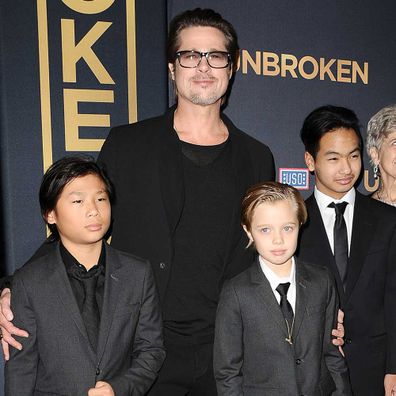 Brad Pitt, Pax Jolie-Pitt, Shiloh Jolie-Pitt and Maddox Jolie-Pitt in 2014.
