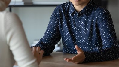 Woman meeting with boss at office