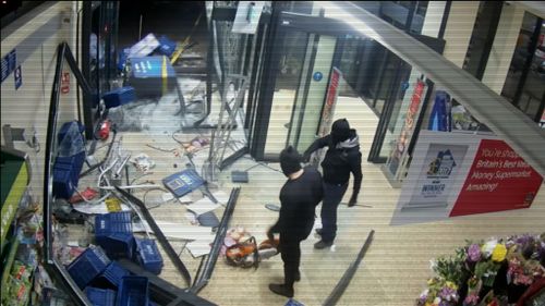 They were trying to get to the ATM inside when the vehicle became stuck.