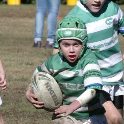Ryder playing rugby
