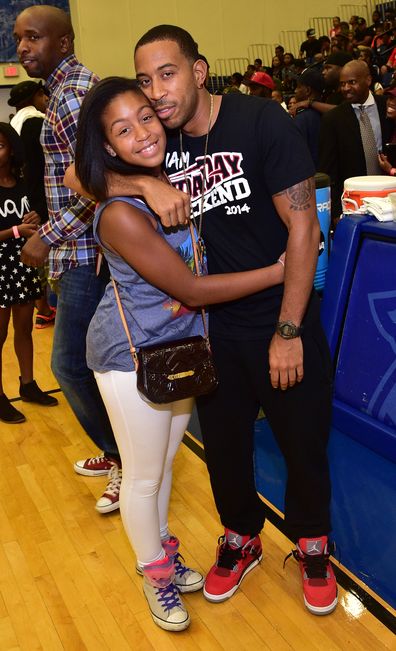 Karma Bridges and Ludacris attend the LUDA vs YMCMB celebrity basketball game at Georgia State University Sports Arena on August 31, 2014 in Atlanta City. 