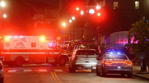 Law enforcement work the scene after two staff members of the Israeli Embassy in Washington were shot and killed outside the Capital Jewish Museum.