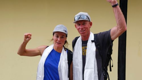 Hilaree Nelson and partnerJames Morrison raise their fists after the pair arrived in Kathmandu in Ocotber 2018 after successfully skiing down from the summit of the world's fourth-highest peak Mount Lhotse.