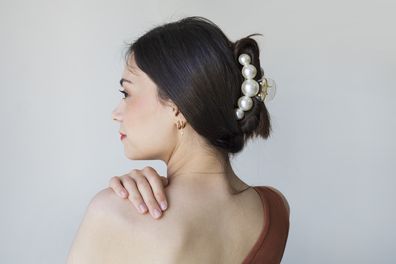 woman wearing elaborate hair clip