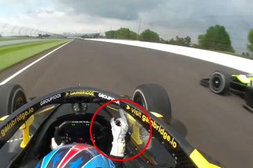 Colton Herta pokes his middle finger at Christian Rasmussen in practice at the Indianapolis 500.