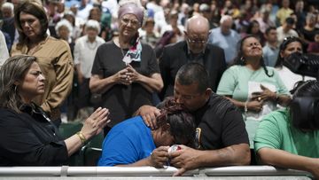 Family members of one of the victims killed in Tuesday&#x27;s shooting at Robb Elementary School embrace each other after a prayer vigil in Uvalde, Texas.