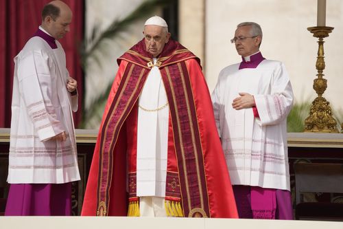 Pope Francis arrives on the altar to celebrate the Palm Sunday's mass in St. Peter's Square at The Vatican Sunday, April 2, 2023