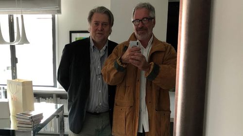 This undated photo released by Democrats on the House Oversight Committee shows Steve Bannon and Jeffrey Epstein taking a photo together.