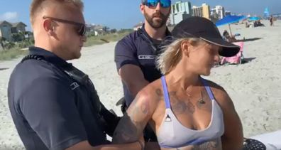 I'm not nude!': Acrobat handcuffed after wearing thong to Myrtle