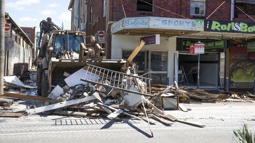 Debris strewn through Lismore's CBD after the second flood in a month.