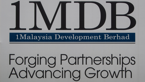 A billboard for state investment fund 1 Malaysia Development Berhad (1MDB) at the fund's flagship Tun Razak Exchange development in Kuala Lumpur, Malaysia. (AP Photo/Joshua Paul, File)