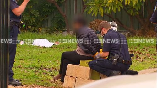 Woman charged with murder after mother's body found in Adelaide front yard
