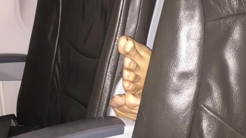 The disgruntled passenger moved seats before taking the photos. (Facebook)