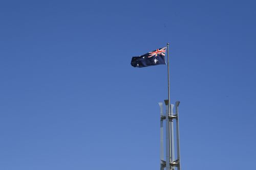 The flag that flies atop Parliament House is the size of a double decker bus. (AAP)