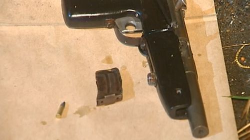 A handgun was found near the car. (9NEWS)