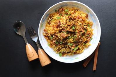 Mutton Biryani or Lamb Pulao. Garnished with fried onion & chopped coriander. 