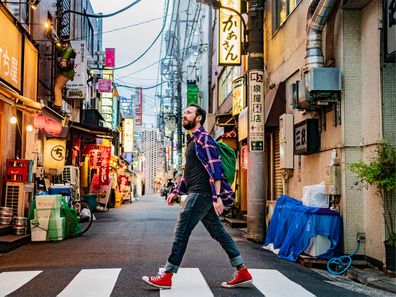 Tourist walking on streets of Japan.