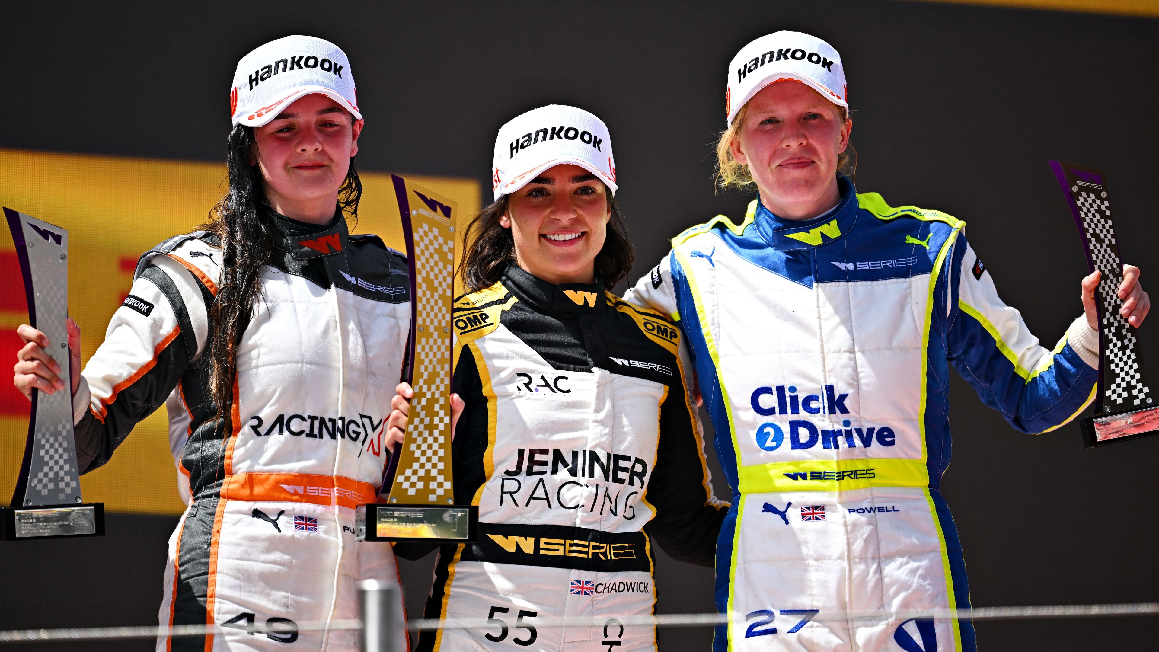 Jamie Chadwick (centre) of Great Britain with Abbi Pulling (left) and Alice Powell (right) on the podium in Spain.