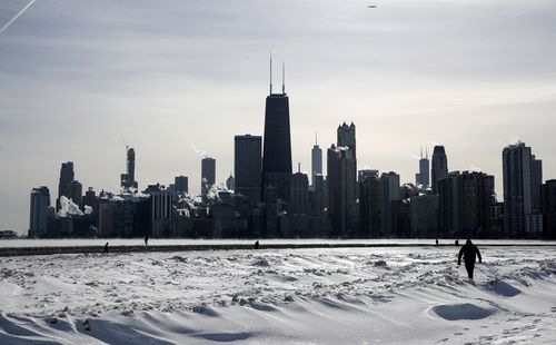 Steam rises from the city buildings and Lake Michigan in Chicago, Illinois.