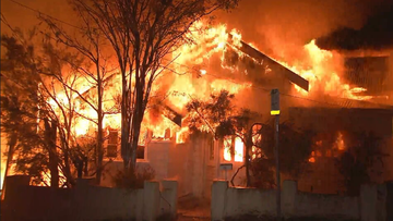 Multiple homes have been engulfed by a fire in Brisbane.