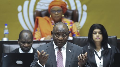South African President Cyril Ramaphosa answers questions in parliament in Cape Town, South Africa, Thursday, May 11, 2023. 