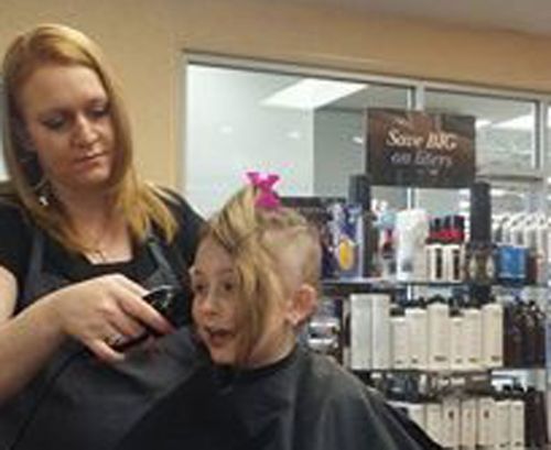 The eight-year-old shaved her hair last week.  (Joanne Weyand Nicklow/ Facebook)