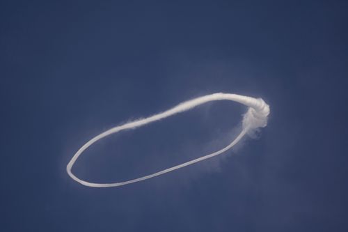 A smoke ring wafts above Etna
