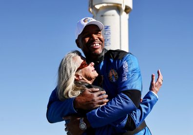 Good Morning America co-anchor and former NFL star Michael Strahan embraces Laura Shepard Churchley, daughter of astronaut Alan Shepard.