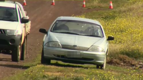 Two people were found dead in the silver sedan at Plumpton. (9NEWS)