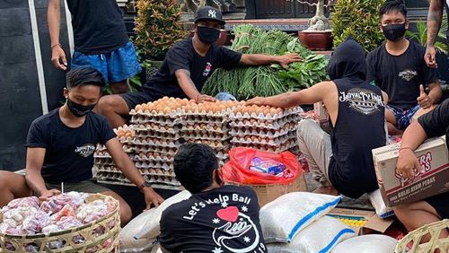 Volunteers prepare packages of to deliver to villages as part of the scheme established by Ms Gee and Ms Rialdi.