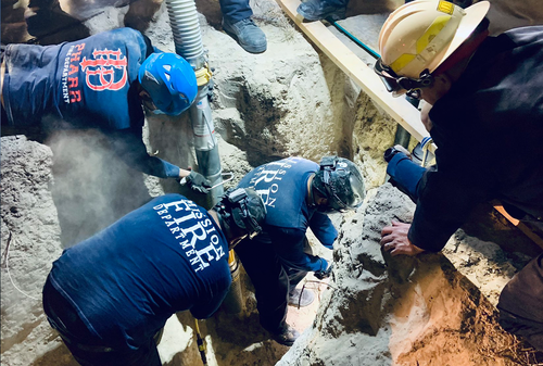 An image released by the City of Mission, Texas, shows rescuers working to free the boy from the well.