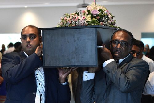 Father Sameer Sahib carries the small coffin at the funeral on April 16 in Dandenong, Melbourne.