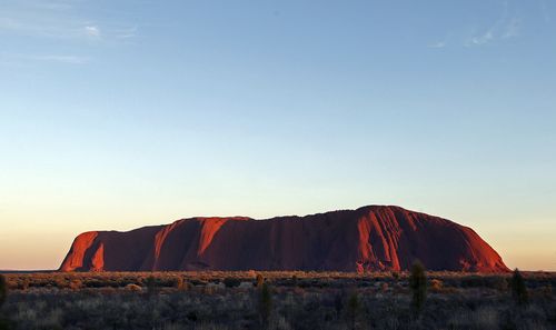 Climbing the dramatic rock formation will be banned at the end of the month. (AP Photo/Rob Griffith, File)