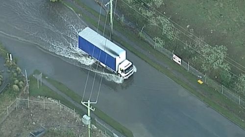 Some drivers ignored warnings about not driving through floodwaters. (9NEWS)