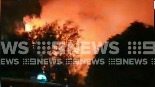 Firefighters remain on the scene this morning after the huge blaze overnight. (9NEWS)