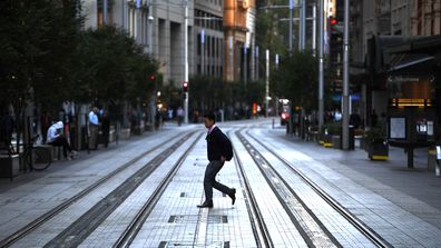 An almost deserted George Street in Sydney's CBD, as social distancing measures see the city largely deserted.