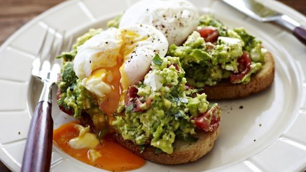 Poached eggs with avocado and feta smash on sourdough