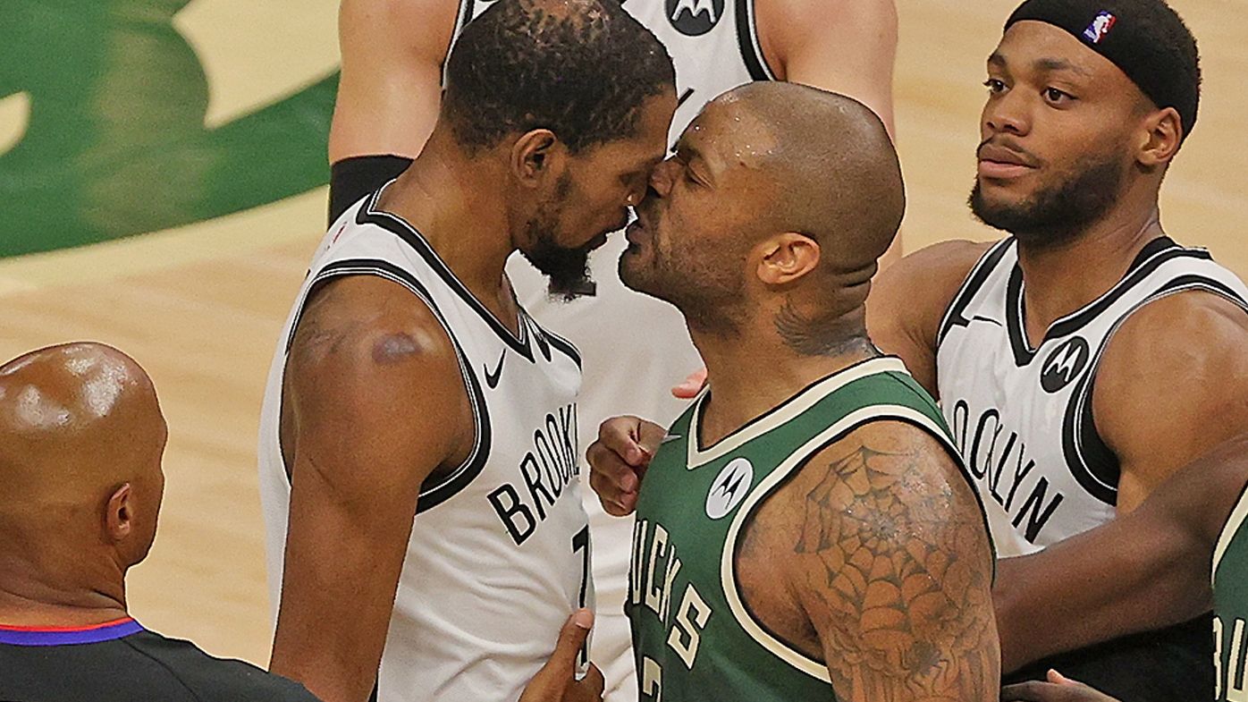 Kevin Durant #7 of the Brooklyn Nets and P.J. Tucker #17 of the Milwaukee Bucks exchange words