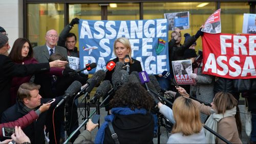 Jennifer Robinson, centre left, a lawyer representing Julian Assange, talks to the media outside Westminster Magistrates Court. (AAP)