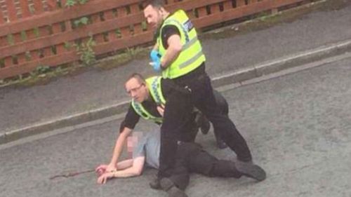 Police detain a man after MP Jo Cox was attacked. (Supplied)