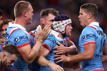 The Roosters celebrate a try in their big Anzac Day win over the Dragons.