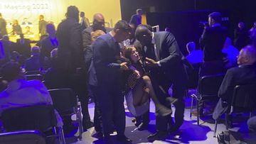 Protesters who tried to storm the stage are taken out of the Excel centre in east London during oil giant Shell&#x27;s annual general meeting in London, Tuesday, May 23, 2023. 