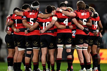 The Crusaders form a huddle during the round 12 Super Rugby Pacific match between Highlanders and Crusaders at Forsyth Barr Stadium, on May 11, 2024, in Dunedin, New Zealand.