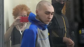 Russian army Sergeant Vadim Shishimarin, 21, is seen behind a glass during a court hearing in Kyiv, Ukraine, Friday, May 13, 2022. 